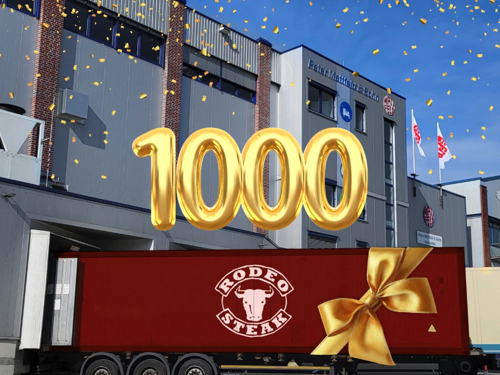 Der 1000. Container mit Rodeo Cuts kam in Hamburg an Großer roter Lkw mit goldener Schleife und einem goldenen Ballon in der Luft